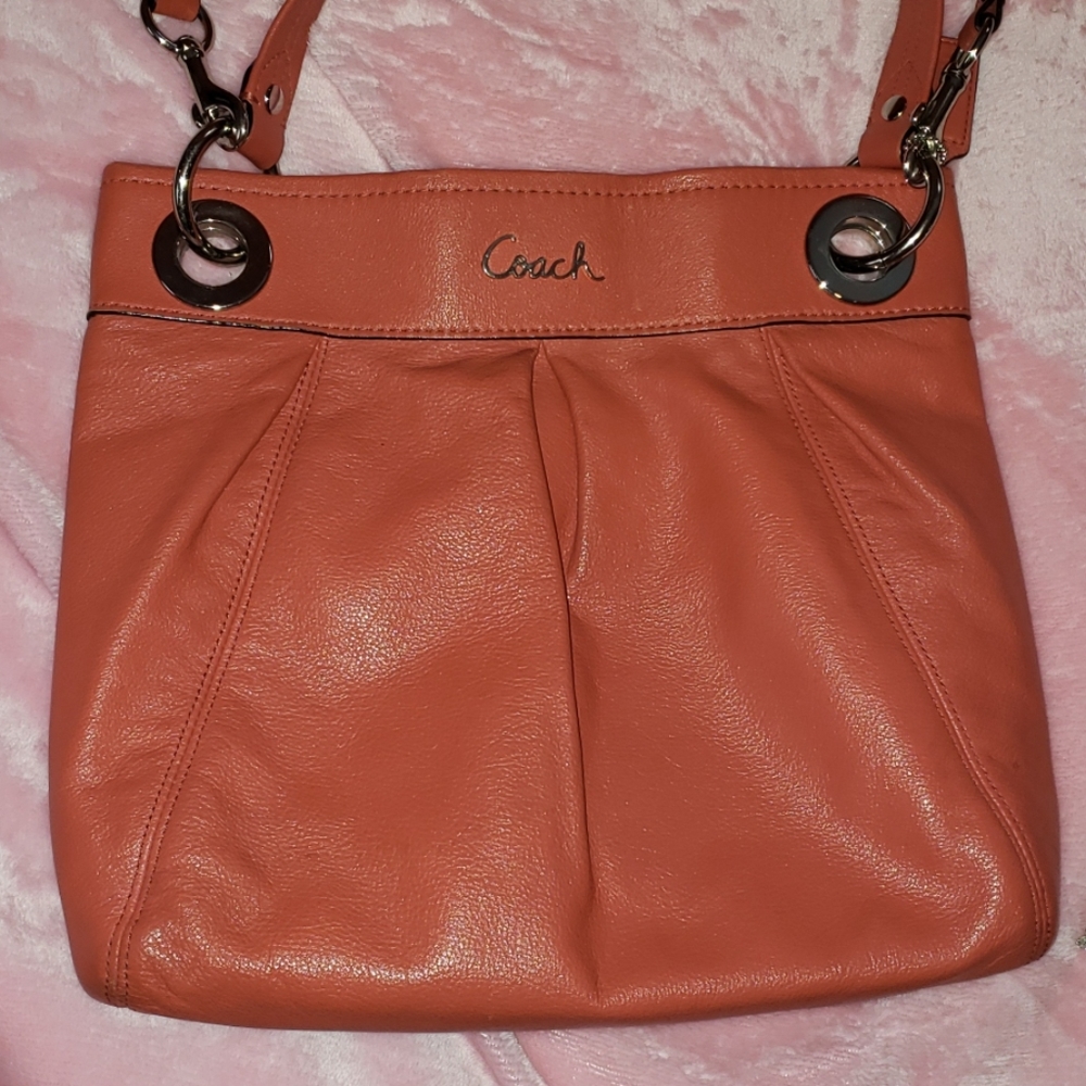 Coach crossbody purse/peach colored